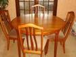 Round extending dining table and 4 chairs